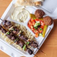 Beef Kebab · Cubes of marinated beef tenderloin, grilled and topped with bewaz mix, pickles and hummus sp...