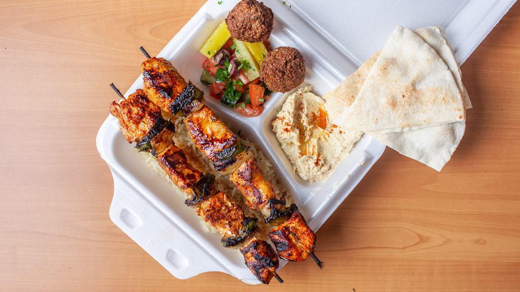 Chicken Kabob Platter · Marinated cubes of chicken marinated with herbs, spices, lemon juice and olive oil. Grilled and served with pickles.