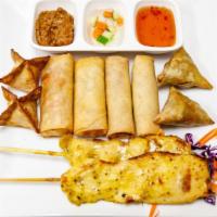Sampler · Combination of two crispy rolls, two vegetable rolls, two satay, two golden triangles and tw...