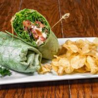 The Gonzalo Wrap · Mixed greens, feta, caramelized Asian pear, bruschetta tomatoes, and citrus vinaigrette on s...