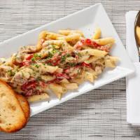 Chicken Alfredo Pasta · Penne, fresh garlic, roasted red peppers, cream sauce, grilled chicken, and Parmesan cheese.