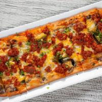 Mexicana Flatbread · Black beans, chorizo, cheese blend, caramelized onions, grilled jalapenos, and cilantro.