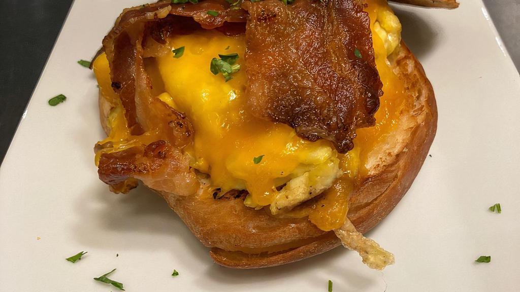 Bec Sandwich · Bacon, scrambled eggs, and cheddar cheese, on a toasted croissant bun.