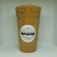 Iced Coffee · Our freshly brewed iced coffee is served over ice with your choice of cream, sugar & flavor ...