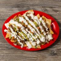 Loaded Nachos · Topped with melted cheese, beans, guacamole, pico de gallo, and sour cream.