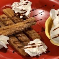 Churros · Churros served with a scoop of vanilla ice cream