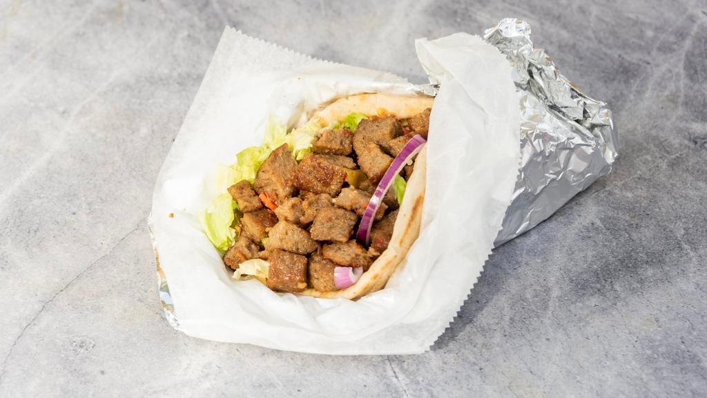 Lamb Gyro · Seasoned grilled lamb in a pita with lettuce, tomato, onion and choice of any or all white, red, green sauce.