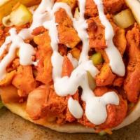 Chicken Gyro · Seasoned grilled chicken in a pita with lettuce, tomato, onion and choice of any or all whit...