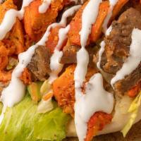 Lamb & Chicken Gyro · Seasoned grilled lamb and chicken with lettuce, tomato, onion in a pita with choice of white...
