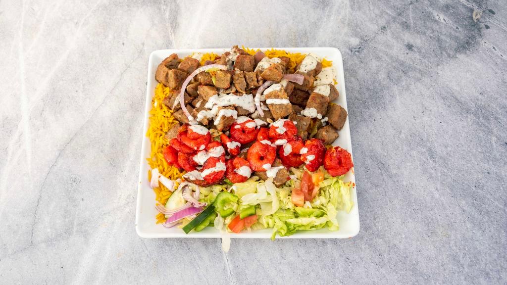 Shrimp Lamb Combo · Shrimp & Lamb Over seasoned Basmati Rice with Side Salad of lettuce, tomato, cucumber, and onion. Gluten free. Choice of any or all white, red, green sauce.