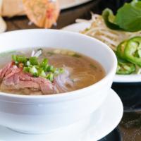 Beef Noodle Soup · Pho tai. Flank steak, rice noodles, beef broth, onions, cilantro-scallion, basil, bean sprou...