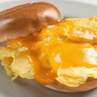 Egg & Cheddar Bagel · Plain bagel with 2 eggs scrambled, cheddar cheese and a choice of side.