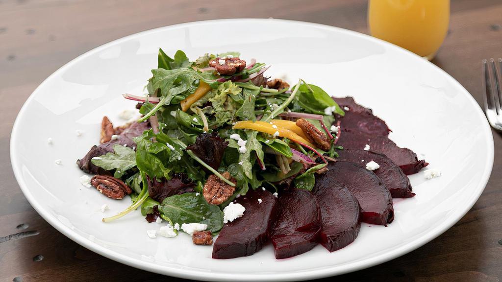 New Roasted Beet Salad · Mixed greens, mango, red onion, goat cheese, candied pecan, cucumbers, yuzu vinaigrette (Vegetarian, Gluten-Free Friendly).. Possible Allergies: Dairy, Nut, Onion