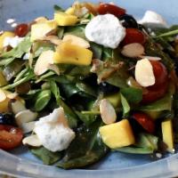 Spinach And Fruit Salad · Baby spinach, mango, blueberries, caramelized onion, grape tomato, goat cheese, roasted almo...
