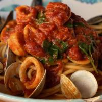 Seafood Bucatini · clams, mussels, scallops, shrimp with Bucatini pasta  with red sauce