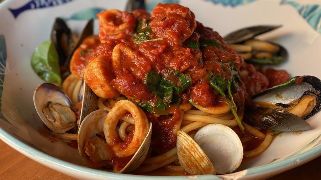 Seafood Bucatini · clams, mussels, scallops, shrimp with Bucatini pasta  with red sauce