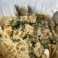 Clams And Bucatini · steamed clams in garlic wine sauce with pasta