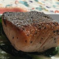 Pan Seared Salmon · Crispy skin with sautéed spinach and parmesan cream