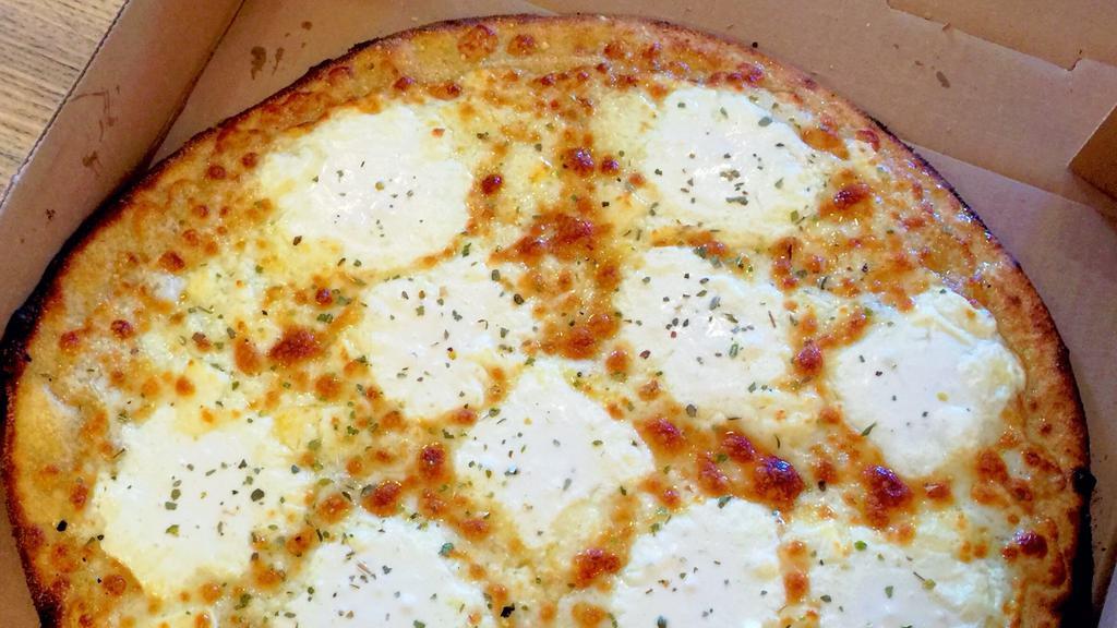 White Pizza (Pizza Bianca) · Cheese heaven!  loaded with our Italian cheese blend, feta crumbles, whipped ricotta,  shredded romano, oregano. 
Note: this sauce has no tomato pizza sauce.