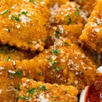 Fried Ravioli (New) · Cheese filled ravioli, breaded & deep fried and garnished with parsley & romano cheese!  Ser...