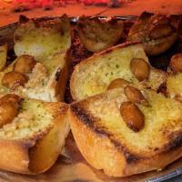 Oh My Garlic! (New) · Our Wood~Fired Garlic~Bread topped with Roasted Garlic and Chopped Garlic!  Served with our ...