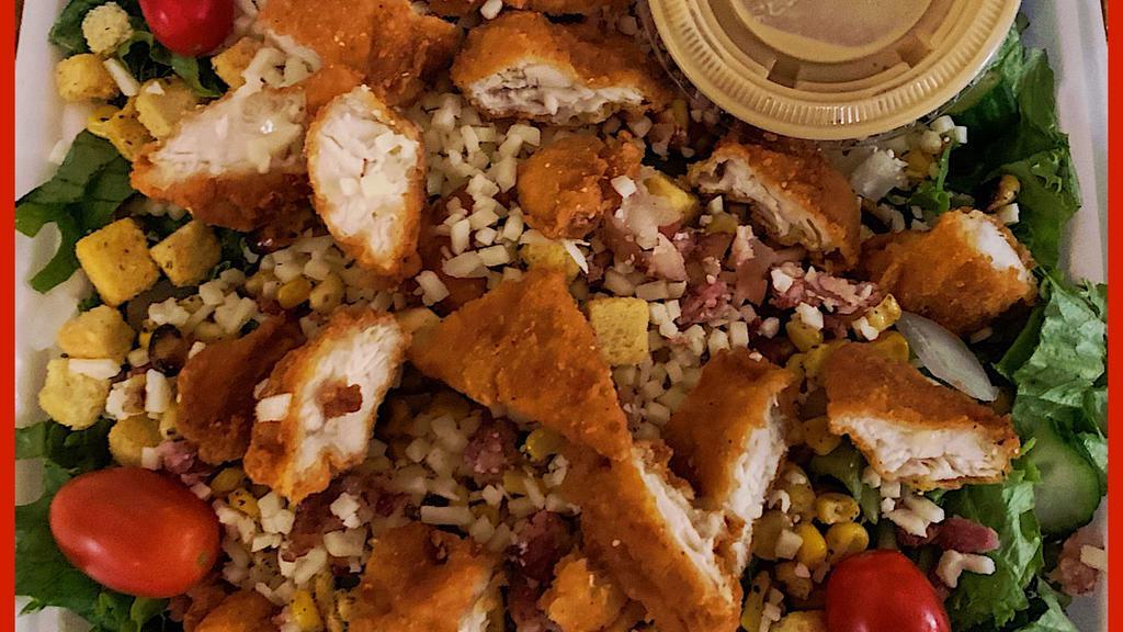Crispy~Chicken Salad · House salad with fire roasted corn, applewood smoked bacon, sliced breaded chicken tenders, mozzarella, side honey mustard dressing.