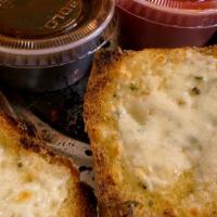 Cheesy Garlic Bread (New) · A great Starter!
Our Wood~ Fired Garlic Bread, topped with our Pizza Cheese Blend, Toasty & ...
