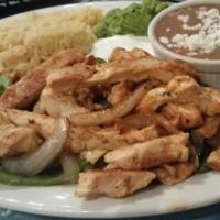 Fajitas · Served with green peppers, rice and beans.