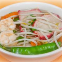 Japanese Udon Noodle Soup · Japanese udon noodle, jumbo shrimp, pork strips, pea pod, bean sprouts and carrot.