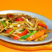 Satay Beef · Hot & spicy. Beef with red and green pepper, onion sauteed in a satay sauce. Served on a siz...