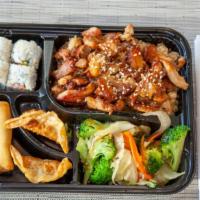 Chicken Bento · Served with mixed vegetables. Four pieces California roll, two pieces chicken dumpling, and ...