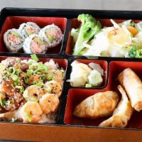 Chicken And Shrimp Bento · Served with mixed vegetables. 4 pieces California roll, 2 pieces chicken dumpling, and 2 pie...