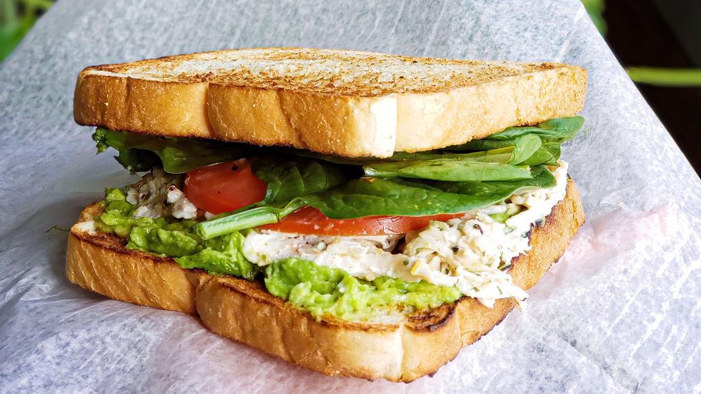 Chicken Salad Sandwich · Served with your choice of bread. Fresh chicken breast, lettuce, tomato, onion, mayo with bagel chips and pickle on the side.