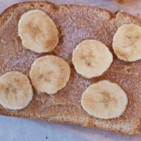 Peanut Butter Toast · Served with two slices of bread with peanut butter, banana, cinnamon sugar.