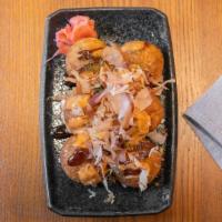 Takoyaki · Fried octopus balls with our Okonomi sauce, six pieces.
