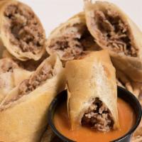 Cheesesteak Spring Rolls · Fried onions, and American cheese.