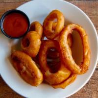 Onion Rings · Breaded and Fried Onion rings served with Ranch.