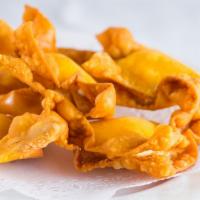 Crab Rangoon · Shredded crabmeat mix cream cheese, folded into a wonton wrapper, and deep fried served with...