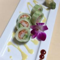 Naruto · Salmon, avocado, and crab stick rolled with thinly cucumber wrap serve with mango sauce.