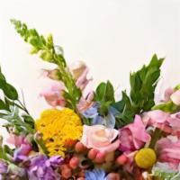 Wrapped Spring Bouquet · Fresh seasonal flowers hand wrapped with a bow. Similar to the flowers shown.