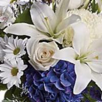 Beautiful In Blue · Beautiful blooms such as blue hydrangea, crème roses, white lilies and alstroemeria along wi...