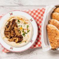 Chicken Shawarma Hummus Bowl · Spiced Chicken Thighs with Caramelized Onions served on Homemade Fresh Daily Hummus with Oli...