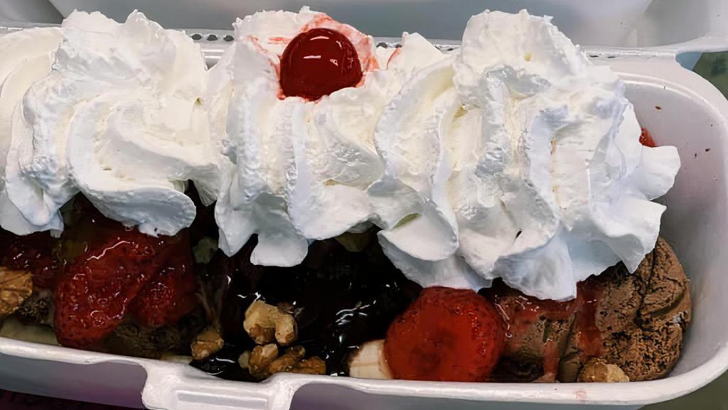 3 Scoops Banana Split · Our banana split sundae comes with hot fudge, strawberries, pineapple, whipped cream and a cherry.