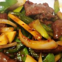 Basil Beef · LargeSpicy. Slices of beef sautéed with mushrooms, peppers & snow pea in spicy basil sauce.