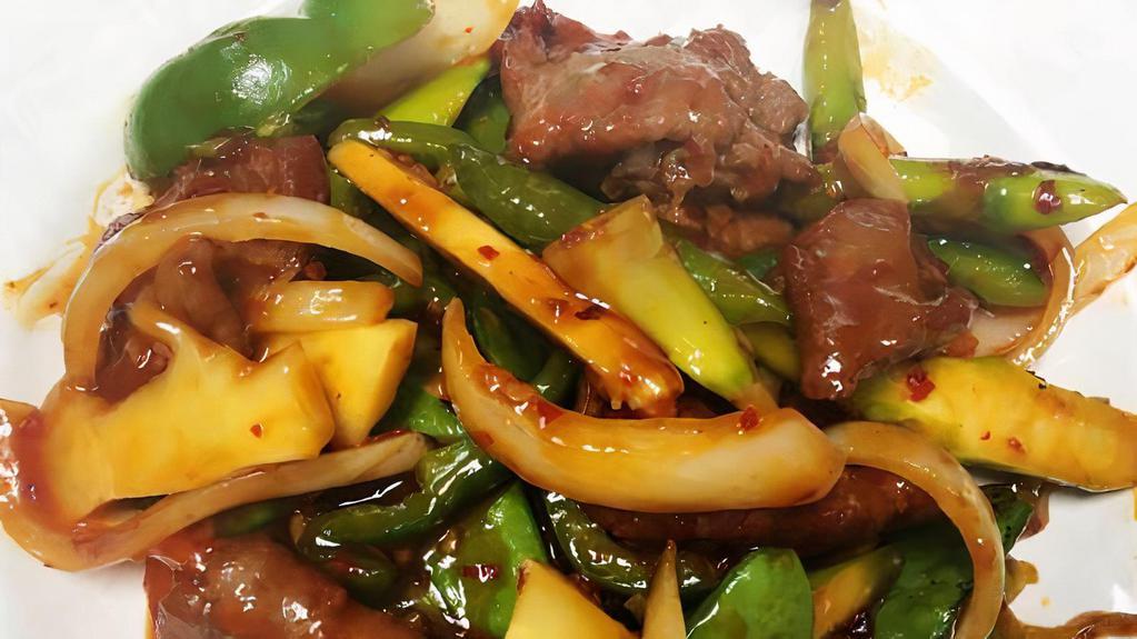 Basil Beef · LargeSpicy. Slices of beef sautéed with mushrooms, peppers & snow pea in spicy basil sauce.