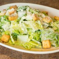 Insalata Cesare · Crisp romaine lettuce, croutons, and imported parmigiano in a delicious Caesar dressing, wit...