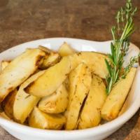 Patate Rosse · Roasted red bliss potatoes in garlic, olive oil, and fresh rosemary.