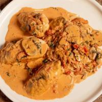 Pollo Valdostana · Stuffed breast of chicken with prosciutto, mozzarella cheese, spinach, mushrooms, and sun-dr...
