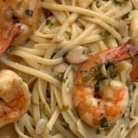 Gamberi Scampi · Shrimp sautéed in a medley of garlic, butter, white wine, and lemon, served over linguini.