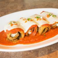 Rollatini Di Melanzane · Three cheeses surrounded by eggplant and baked to perfection with tomato sauce and topped wi...
